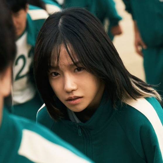 jo yuri squid game 2 salarywoman-greenjacket-serious-blackhair.