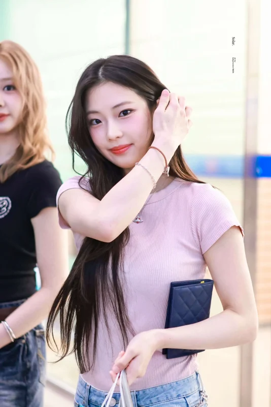 ruka babymonster airport fashionportrait-woman-pinktop-bracelet.