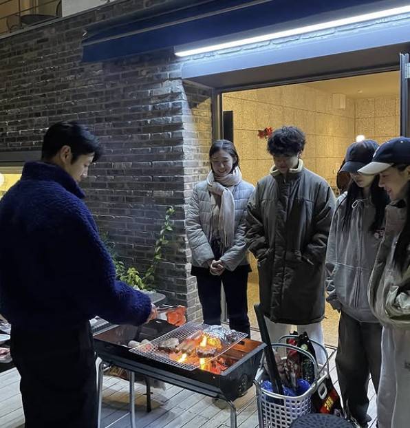 jung joon-won resident playbookbarbecue-friends-outdoors-brickwall.