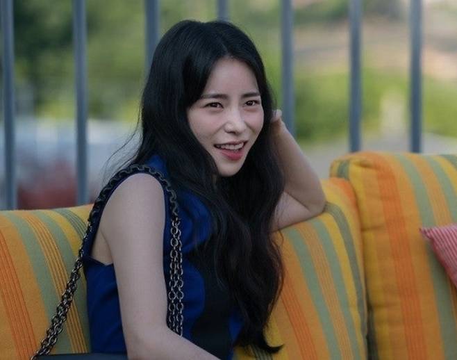 lim ji-yeon baeksang controversywoman-smiling-couch-outdoors.