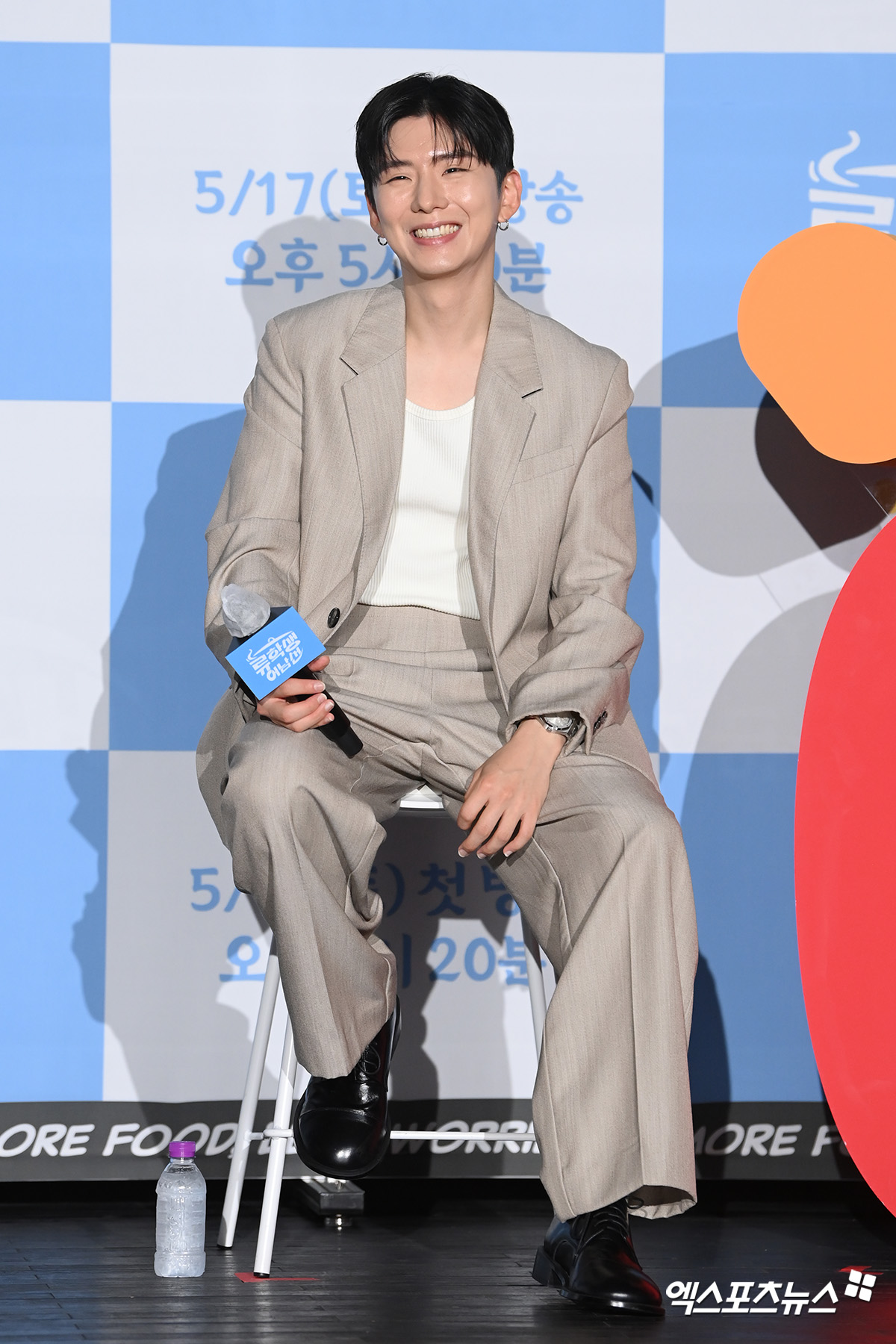 kihyun mr. eo’s food world tourSmiling-Suit-Microphone-Sitting.