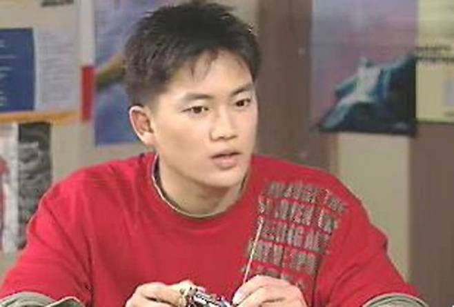 Ji Sung success storyasian-man-red-shirt-model-building.