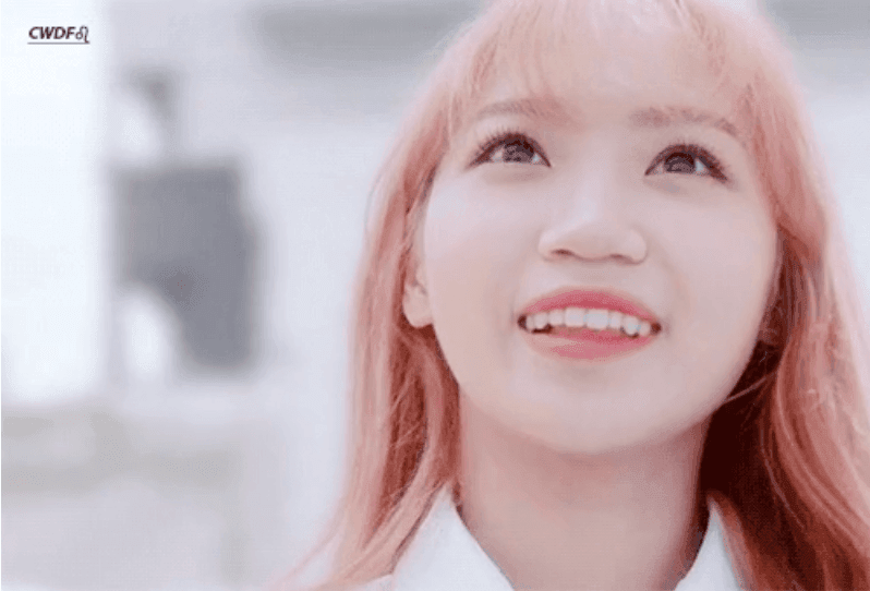 Kim Chaewon plastic surgerywoman-pink-hair-looking-up.