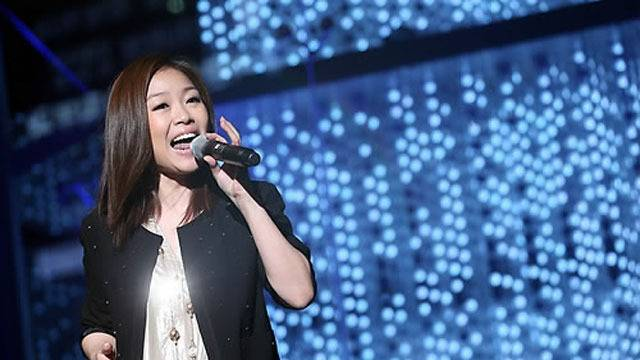 Lena Park vocal cord cystsinger-microphone-performance-stage.