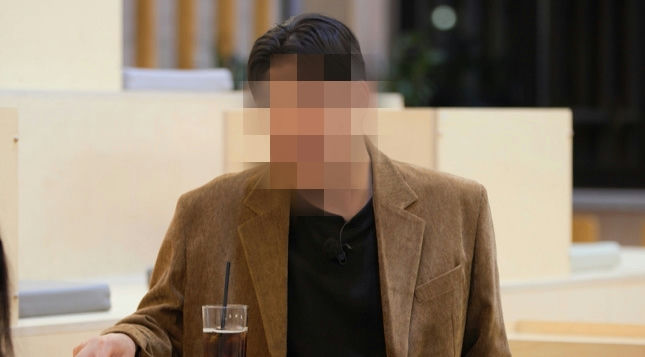 k-pop demon hunters china controversyman-blazer-drink-blurredface.