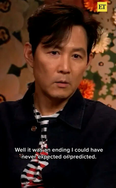 lee jung-jae squid game 3 endingman-interview-stripedShirt-floralWallpaper.