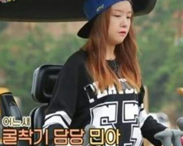 minah excavator licensewoman-hat-sweatshirt-vehicle.