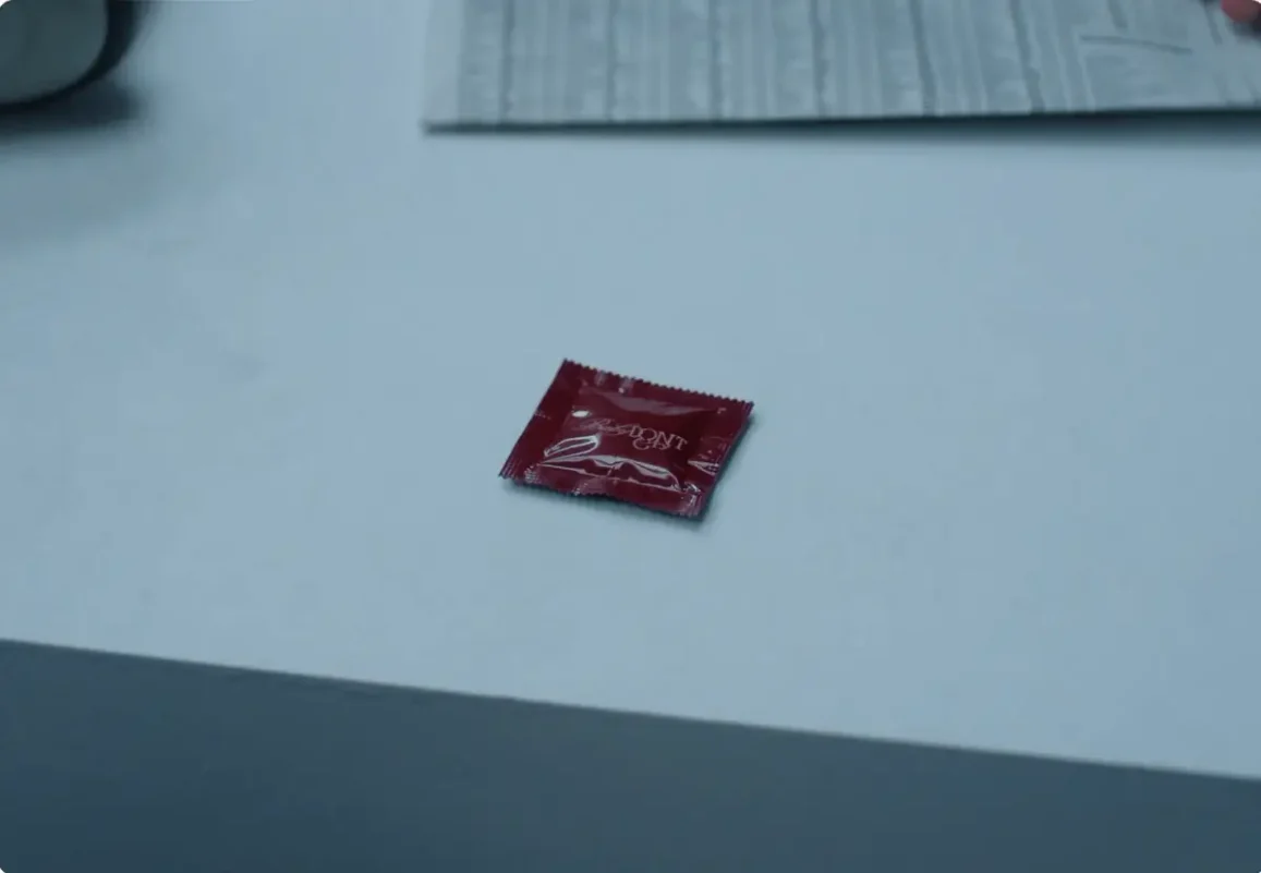 baby dont cry mv controversycondom-packaging-maroon-table.