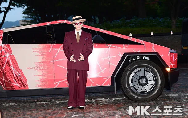 g-dragon net worthperson-Cybertruck-suit-hat.
