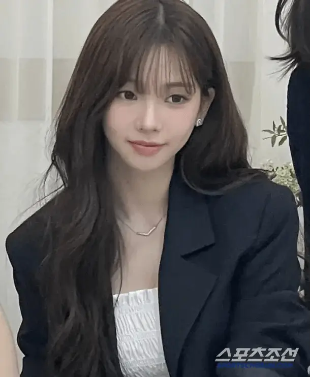 karina sister wedding outfitwoman-bangs-blazer-necklace.