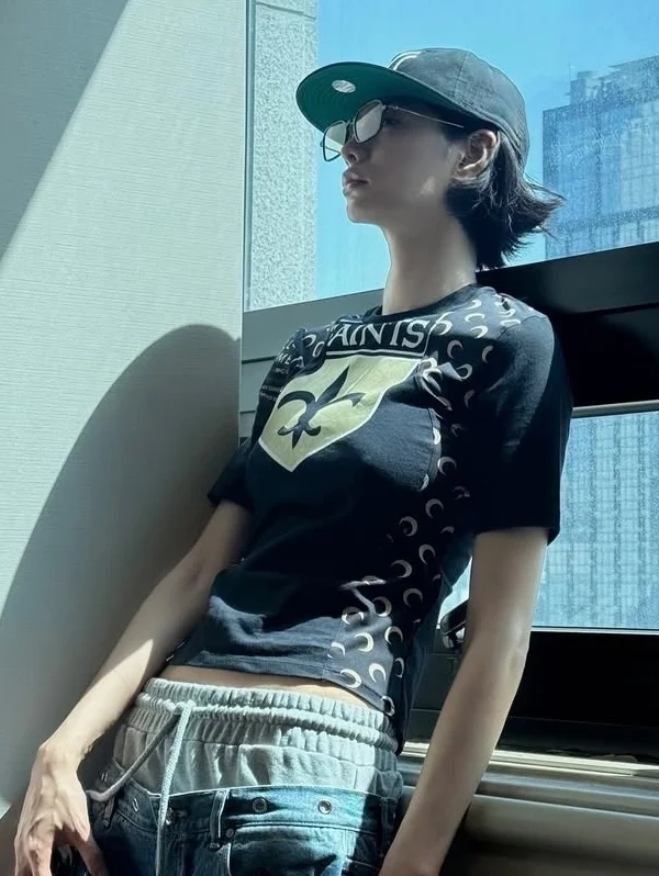 Nana Rocks No-Bra Look with Fading Full-Body Tattoo