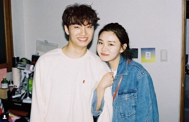 eun jong lawsuitcouple-smiling-casual-indoors.