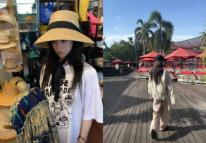 go yoon-jung bali vacationhat-woman-umbrellas-woodenpath.