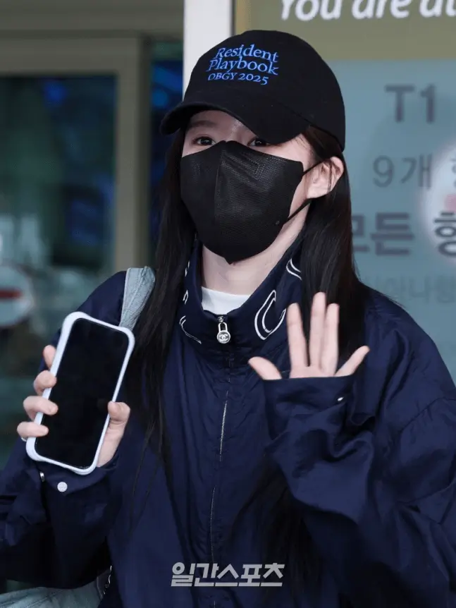 resident playbook bali reward vacationwoman-mask-baseballcap-phone.