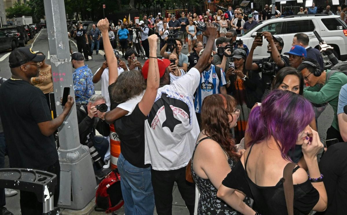 Diddy comeback after trialprotest-raisingFists-crowd-media.