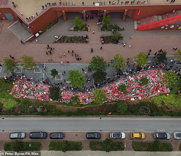 Diogo Jota final momentsMemorial-Scarves-Flowers-Crowd.