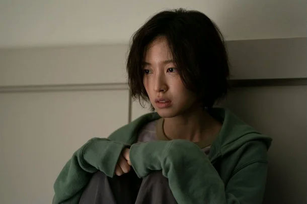Arin S-Line dramadistressed-woman-indoors-hoodie-sad.
